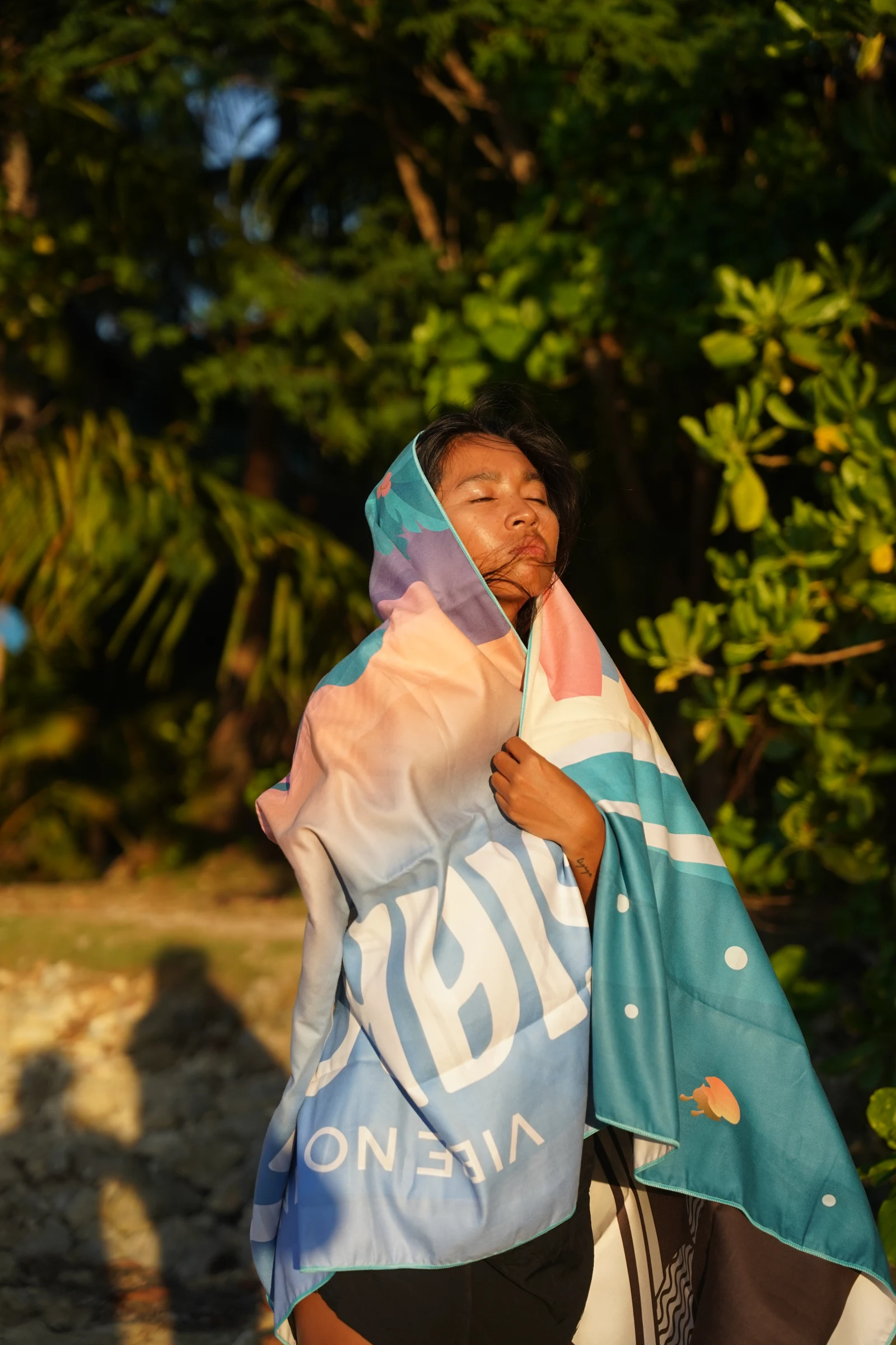 Islas Filipinas towel wrapped around a model at golden hour