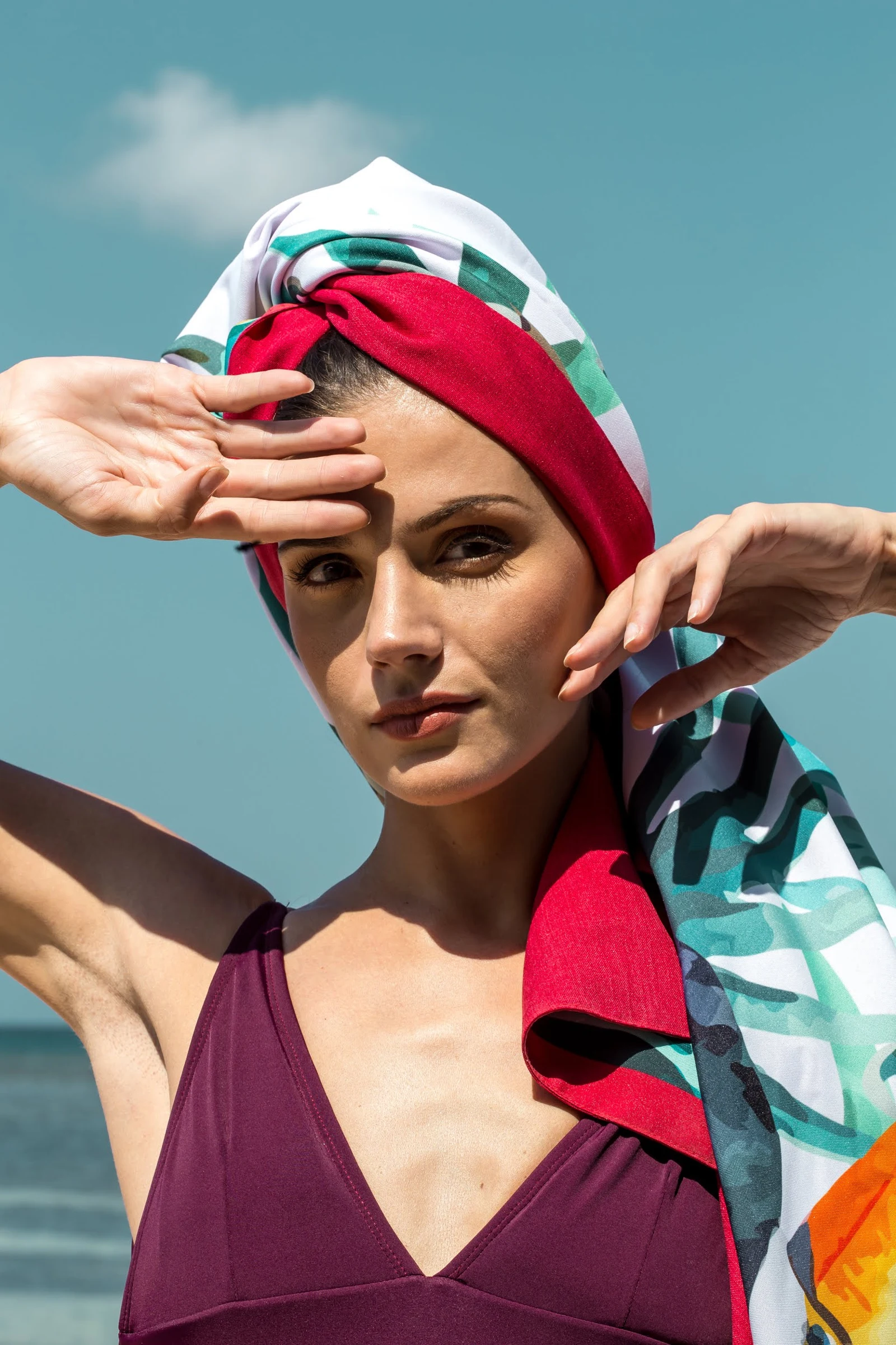 Model wearing a tropical Pintados print as a headwrap